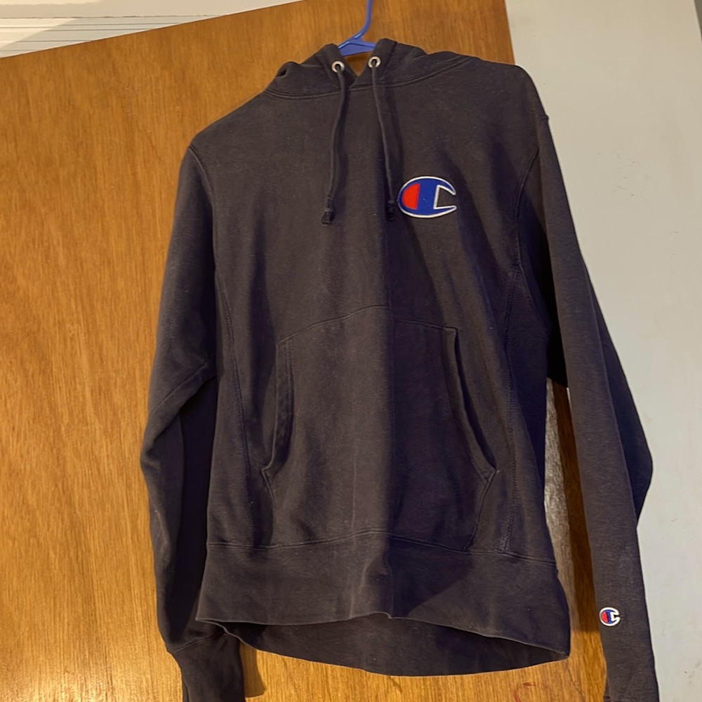 This is a Champion hoodie. It is navy blue and rarely warn.